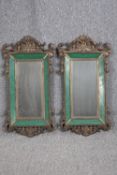 Mirrors, pair, C.1900 Baroque scrolling gilt metal frames with original bevelled plates. H.76 W.