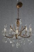 A small French chandelier with five brass branches and crystal drop detailing. H.43 Dia.50cm.