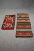 An Eastern rug along with a Kelim runner. L.137 W.60cm. (largest)