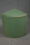 Lloyd Loom basket in light green with label.