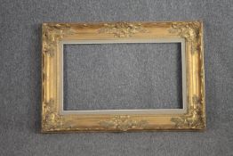 A giltwood and gesso picture frame. H.92 W.117cm.