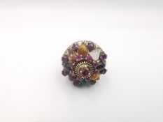 A 14 carat yellow gold plated multi gemstone Harem Thai princess ring. Set with seventeen round