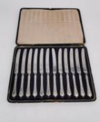 A leather cased set of twelve silver handled butter knives by George Ibbetson & Co. L.30 W.21.5cm