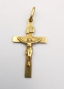 A vintage Italian Unoaerre 18ct yellow gold crucifix pendant with relief figure of Jesus and sign