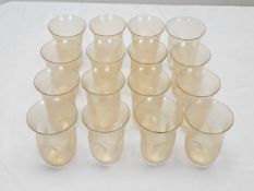 A collection of sixteen hand blown Venetian Murano Avventurina glass tumblers. Each one of a