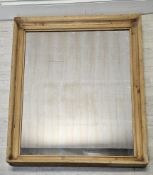 Wall mirror, C.1900, pine frame with original plate. H.145 W.108cm.