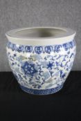 A blue and white ceramic planter. H.35cm.