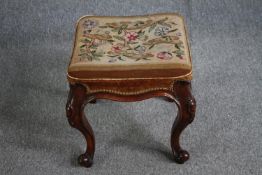 A mid Victorian stool with original tapestry seat on carved mahogany cabriole supports. H.46 W.44