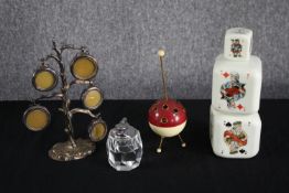 An Art Deco sputnik Bakelite cigarette holder, Italian milk glass playing card design decanter and a