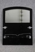 An Art Deco chrome and black glass bathroom mirror. H.84 W.63cm.