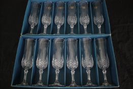 A boxed set of twelve longchamp crystal glasses made by Cristal d'Arques, Paris. H.21cm. (each)