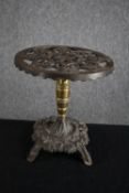 A twentieth century lacquered paper mache tray with floral decoration supported by an iron stand.