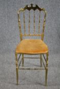 A vintage brass framed salon chair. H.91cm.