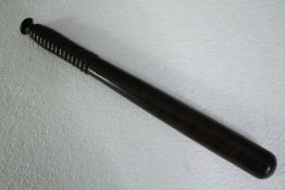 A 19th century teak truncheon. L.39cm.