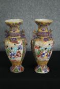 Two Japanese satsuma vases. Glazed ceramics with highly detailed raised figural decoration.