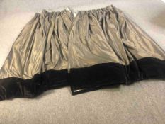 A pair of shot silk gold fully lined curtains with black silk velvet borders to the bottom. L.210