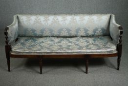 Sofa, 19th century mahogany framed upholstered in powder blue damask with buttoned squab cushion.