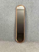A contemporary gilt metal framed pier mirror. H.132 W.29cm.