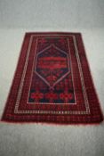 Rug, Turkish Yagcibedir with central lozenge medallion on a midnight ground within stylised multiple