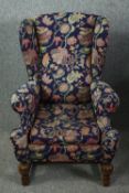 Wing armchair, mid century Jacobean style oak. H.113cm.