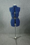 An adjustable tailors dressmaker dummy. Plastic with a metal working and fabric cover. Without a