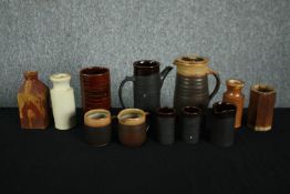 A mixed assortment of stoneware and earthenware pots and vases. Includes a matching coffee pot, jug,