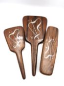 A Danish mid-century silver and rosewood brush ands mirror dressing set by designer Axel Salomonsen.