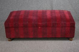 A contemporary upholstered ottoman. H.43 W.120 D.58cm.
