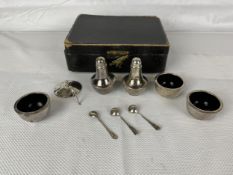 An English hallmarked cruet set, 162g, one piece and fitted box damaged as seen.