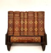 An early 20th century desk library by Asprey of London with complete set of leather bound books.