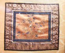 A framed and glazed 19th century Chinese silk embroidery, depicting flowers and butterflies with
