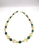 A boxed Past Times necklace based on a Roman Lyre necklace from 2nd century AD, gold plated on