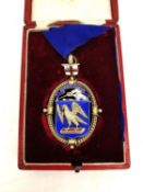 A leather fitted cased white metal (tests as silver) and enamel Master of Scriveners guild medal. '