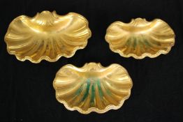 A set of three heavy gilt metal card trays or soap dishes of scalloped form. L.23 W.15cm. (Largest).