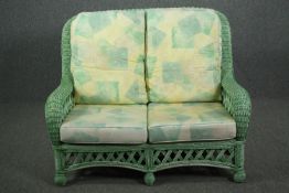 A contemporary loom style conservatory sofa. H.103 W.130 D.80cm.