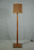 A mid century Art Deco style oak standard lamp. H.176cm.