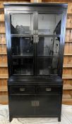 A two part Lombok library bookcase. H.211.5 W.100 D.45cm.