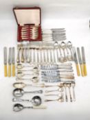 A large collection of silver plated flatware to include some steel and bone handled pieces.