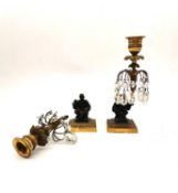 A pair of 19th century gilt bronze candle holders with crystal drop lustres and patinated bronze