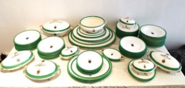 A 19th century hand painted large twelve person part dinner service with Christie coat of arms,