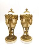 A pair of Louis XVI style gilt mounted marble cassolette candlesticks, the combination tops