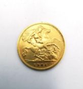 An Edward VII 1906 gold half sovereign in coin capsule.