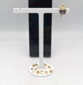 A collection of scrap gold, including an 18ct carat yellow gold and amethyst clip earring,four