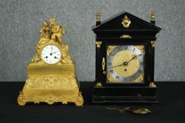 A 19th century French gilt metal mantel clock and a late 19th century ebonised and ormolu mounted
