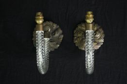 A pair of cane glass wall sconces on scrolling foliate bronze back plates. H.25cm. (each)