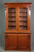 Library bookcase, 19th century mahogany, in two sections. H.211 W.120 D.45cm.