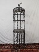 A full height wrought metal wine rack. H.185cm.