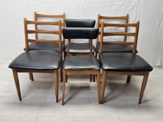 A set of four 1970's vintage teak and vinyl dining chairs by Schreiber along with a pair of similar.