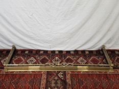 Fire kerb, 19th century brass with adjustable mechanism. W.165cm (small) W.195cm. (extended)
