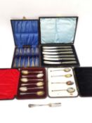 Four cased sets of silverware, six dessert knives with silver blades, a set of six teaspoons, four